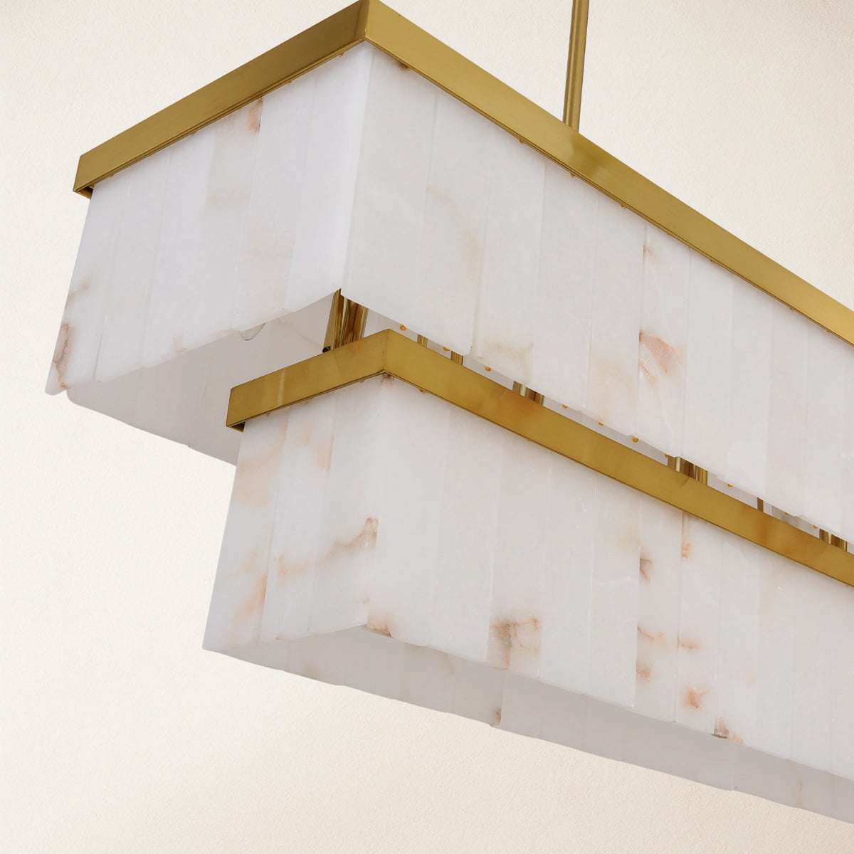 Natural alabaster panels and gold frame edge detail | CARRA HOME