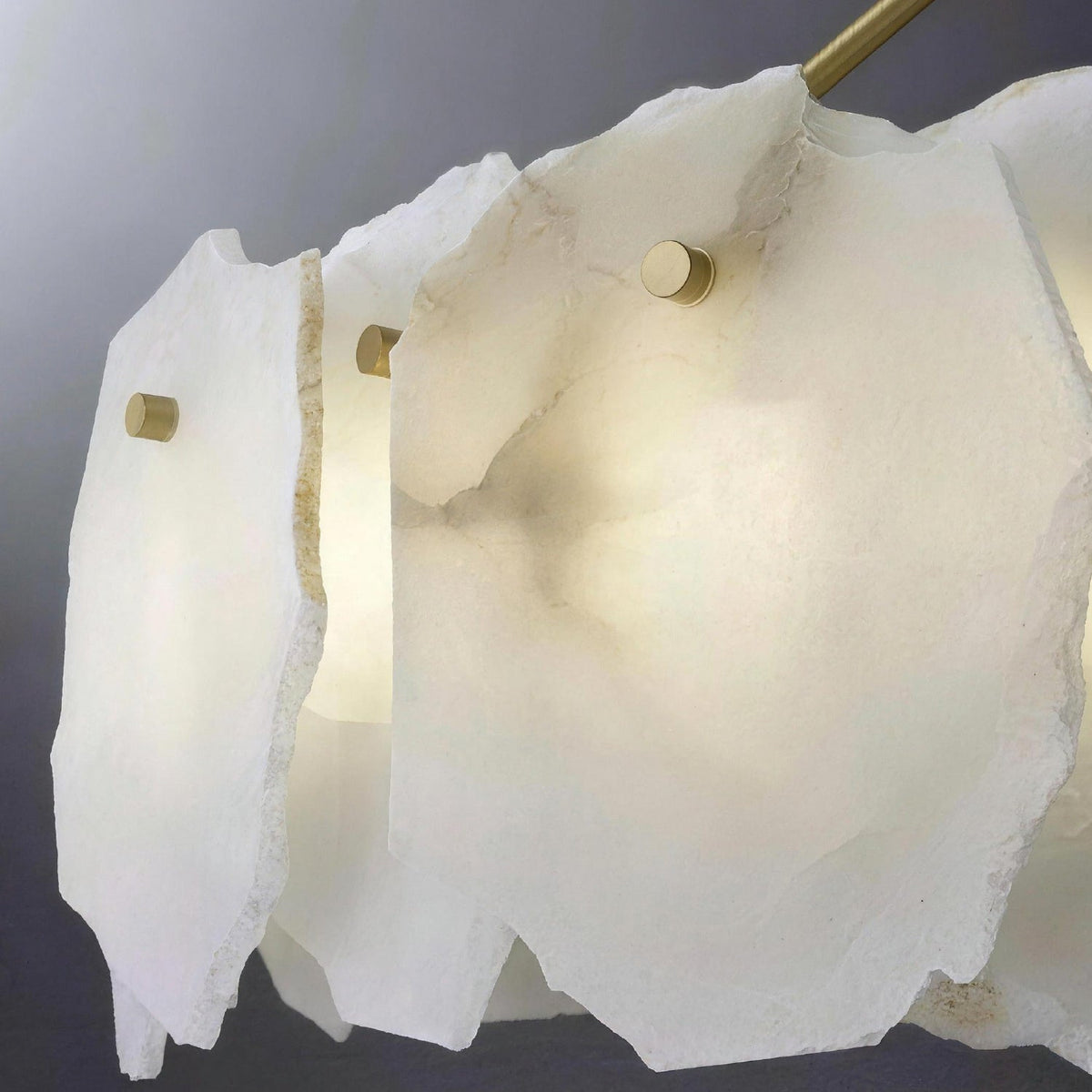 Seravelle Alabaster Layered Chandelier with lights on