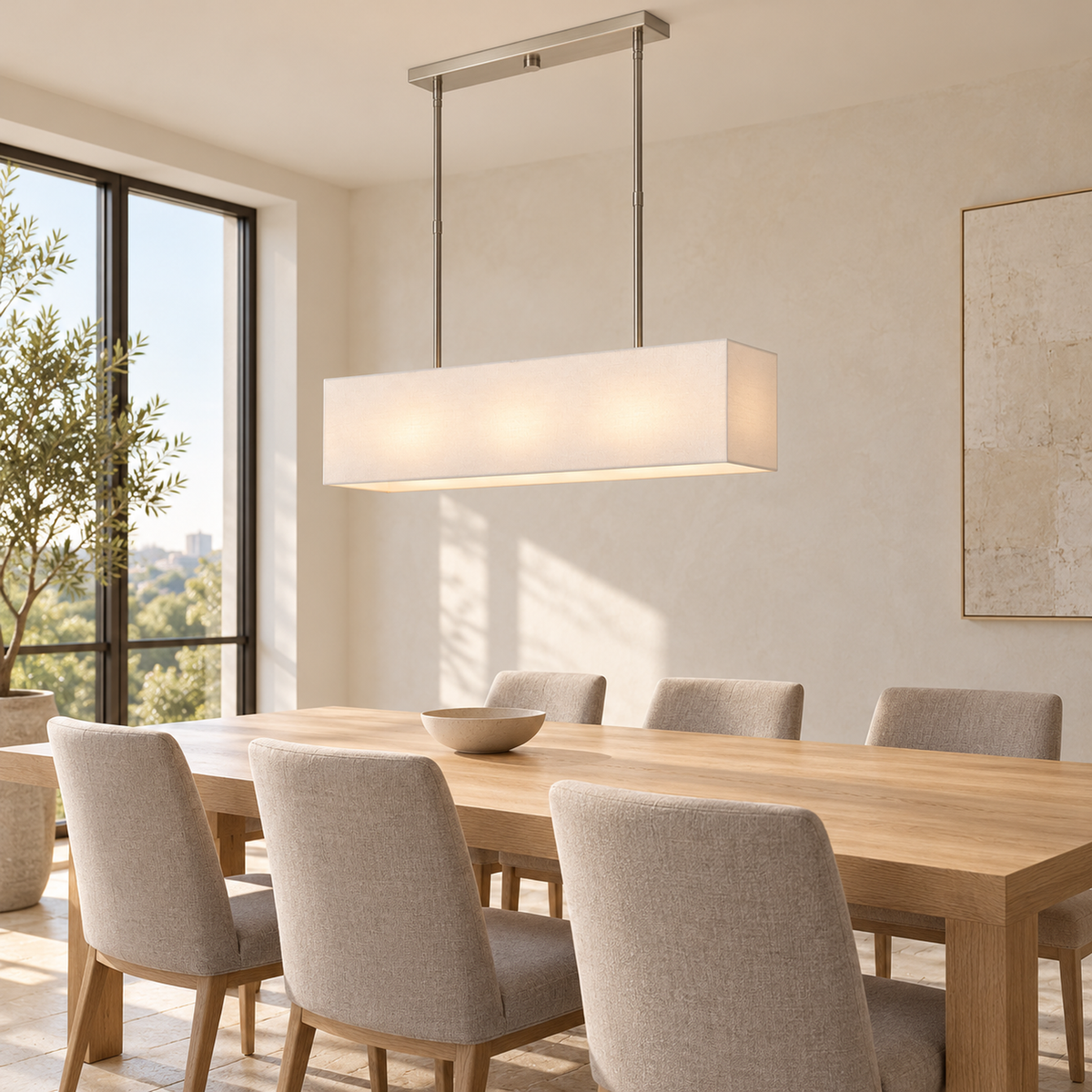 Stark brushed nickel fabric chandelier above a pale oak dining table | CARRA HOME