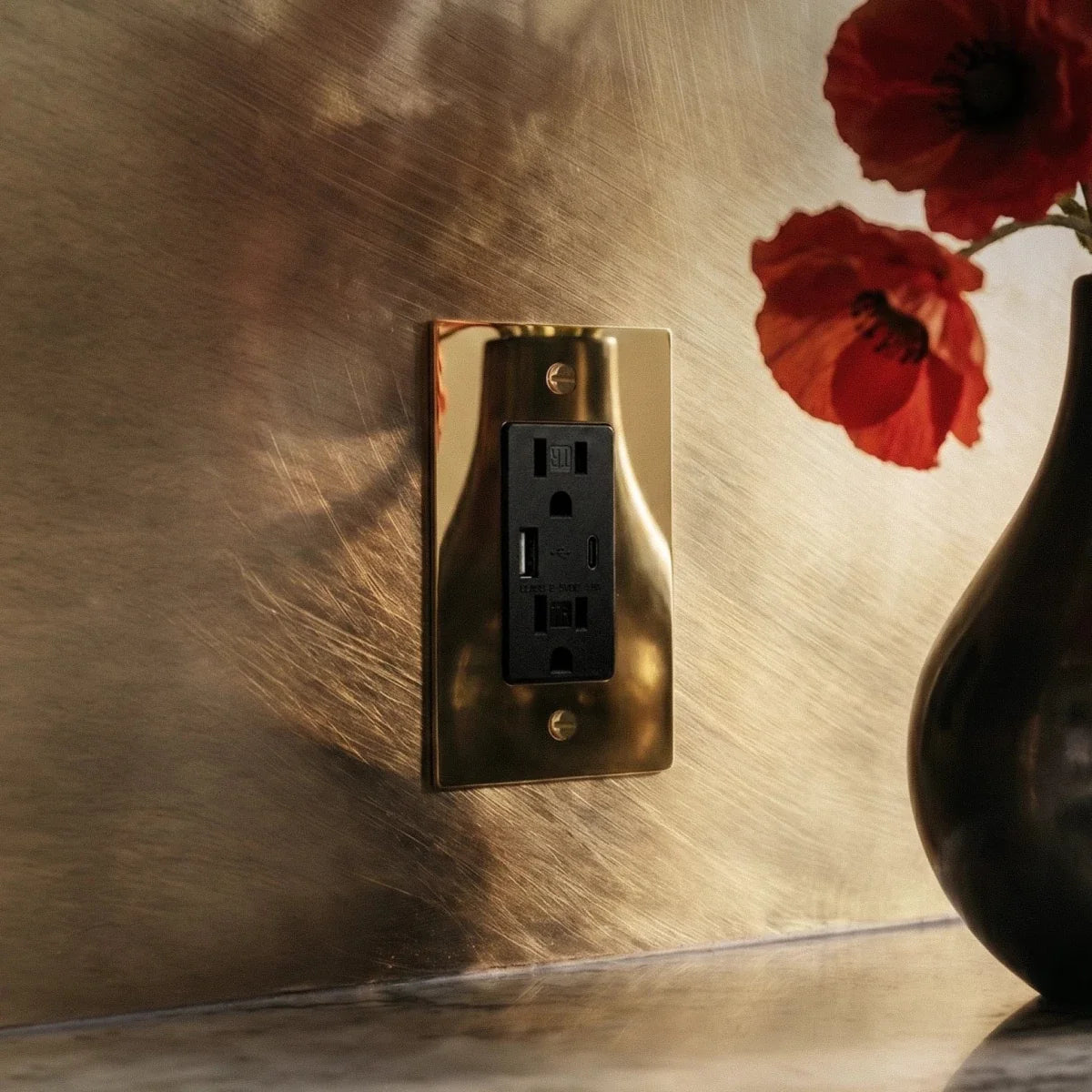 The Polished Brass Outlet — Black USB-C polished brass outlet close-up | CARRA HOME