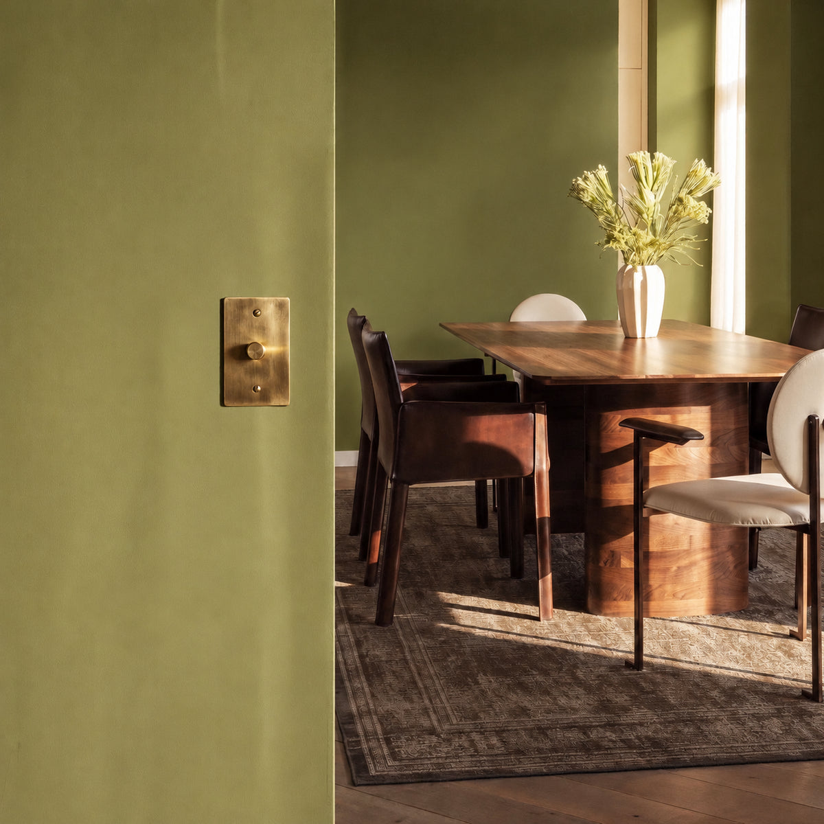 Unlacquered Brass Dimmer Switch installed in an interior, view 8 — seamless faceplate | CARRA HOME