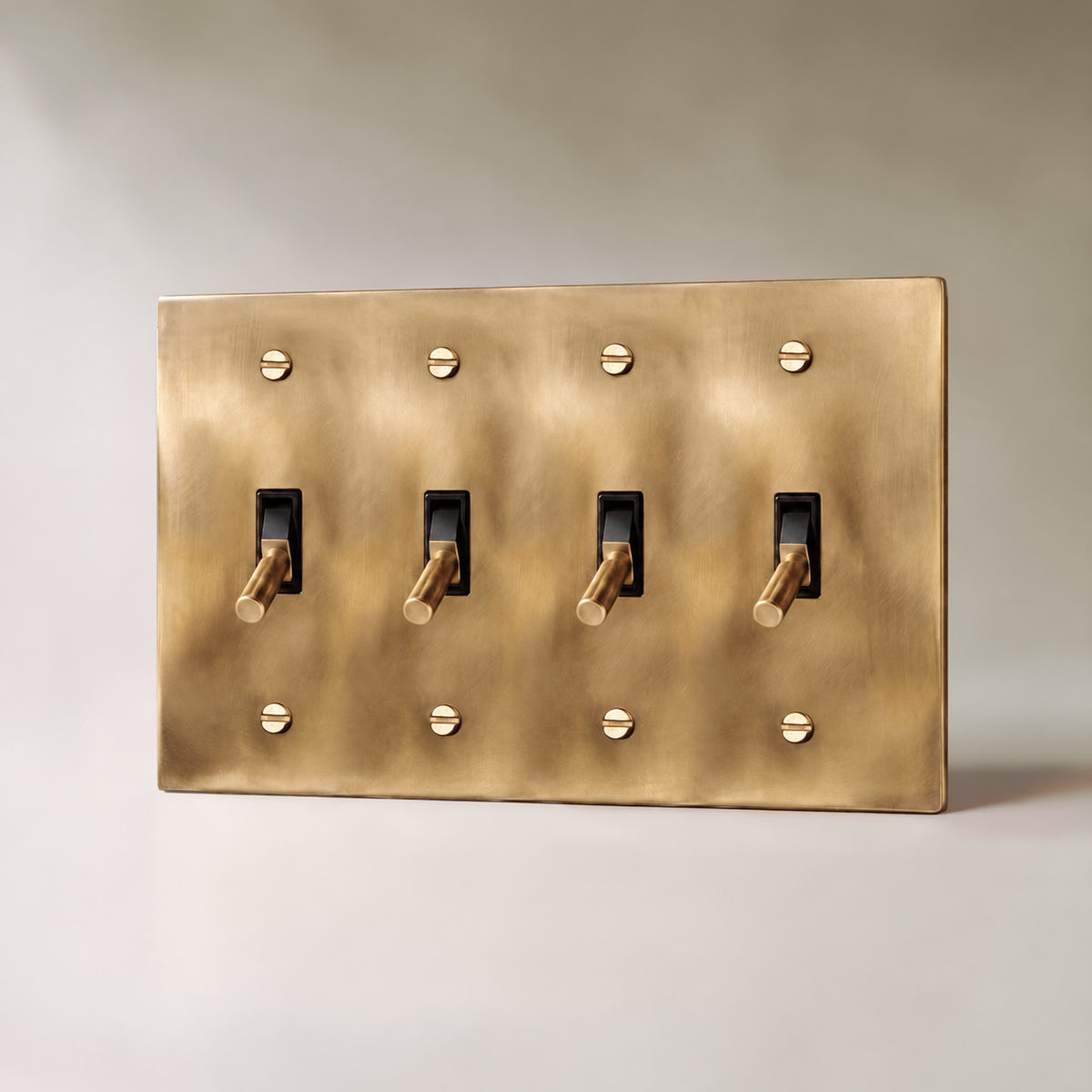 Unlacquered Brass Toggle Switch with seamless brass faceplate, 4 Gang product view | CARRA HOME