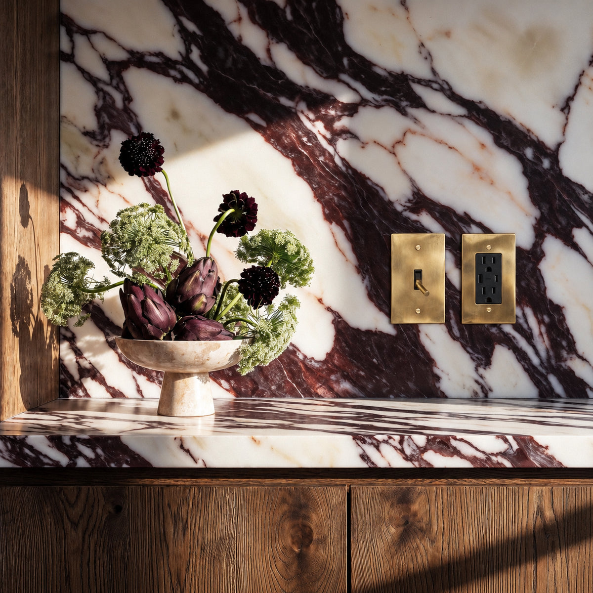 Unlacquered Brass Toggle Switch with seamless brass faceplate installed in an interior, view 6 | CARRA HOME