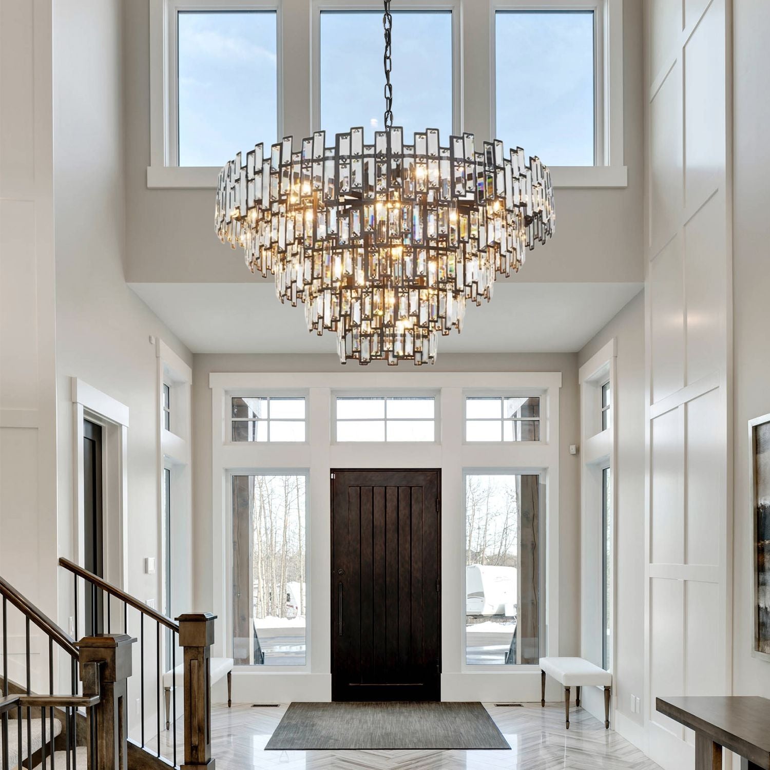 Vera Crystal Prism Tiered Chandelier in a bright foyer — illuminating a dark wood console table, arched French doors, and neutral wall decor | Carra Home