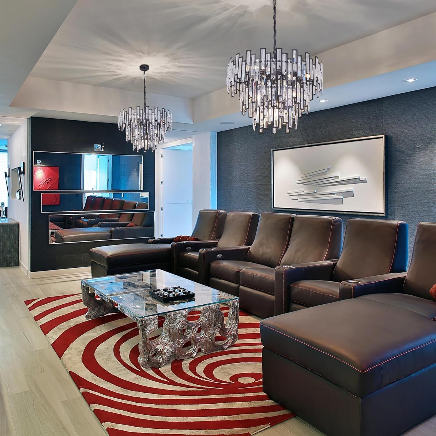 Vera Crystal Prism Tiered Chandelier in a moody living room — suspended above a dark brown leather sofa, glass coffee table, and blue accent wall | Carra Home